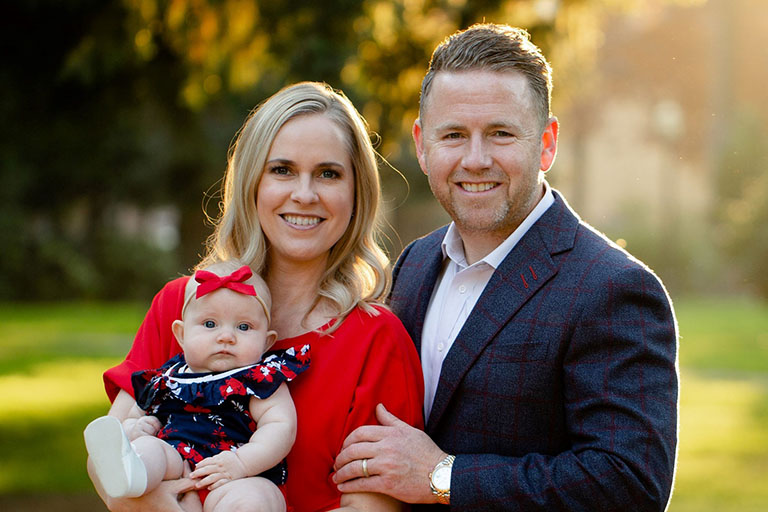 Jason Bryant with his wife and child